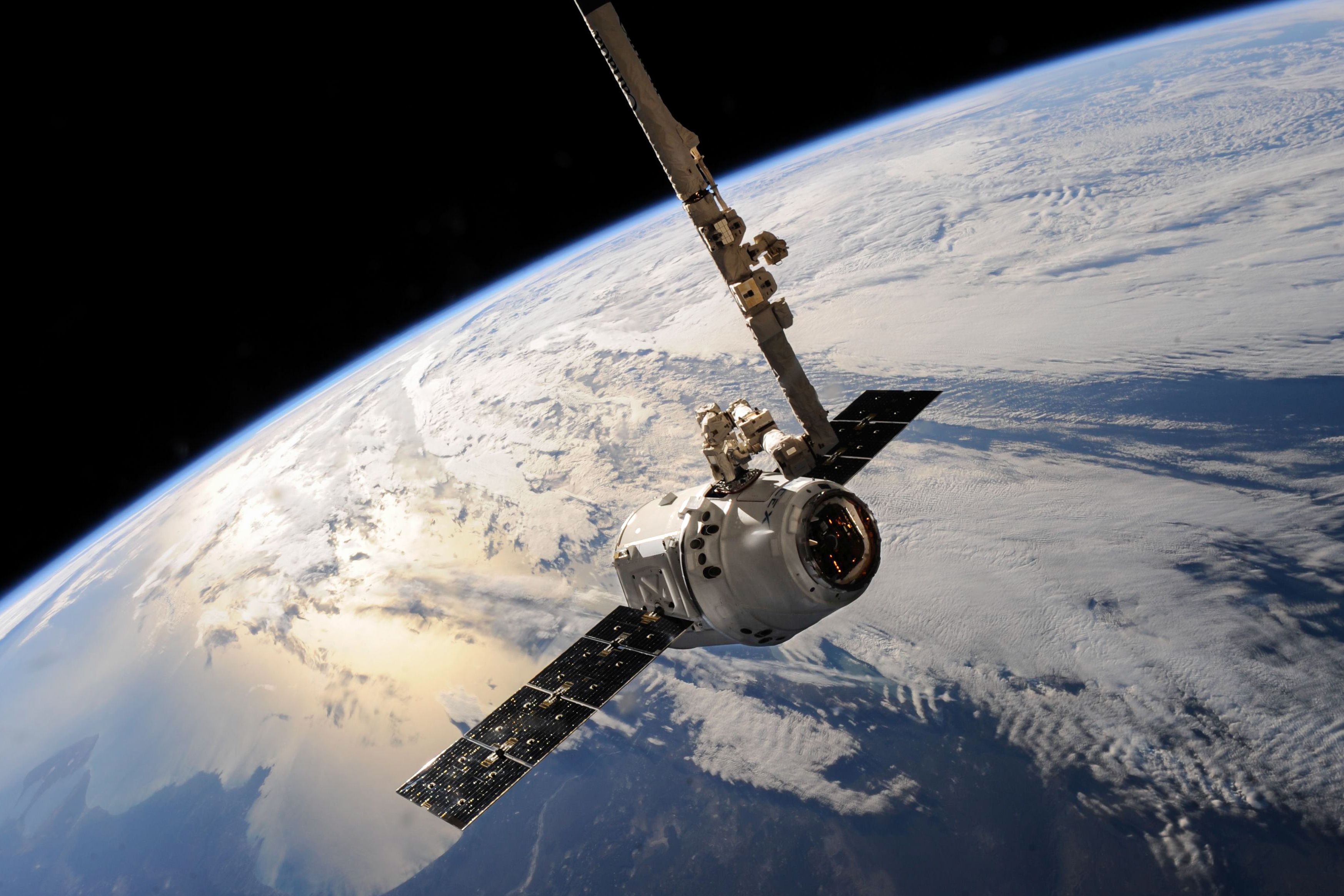 Satellite in low Earth orbit above the curvature of Earth