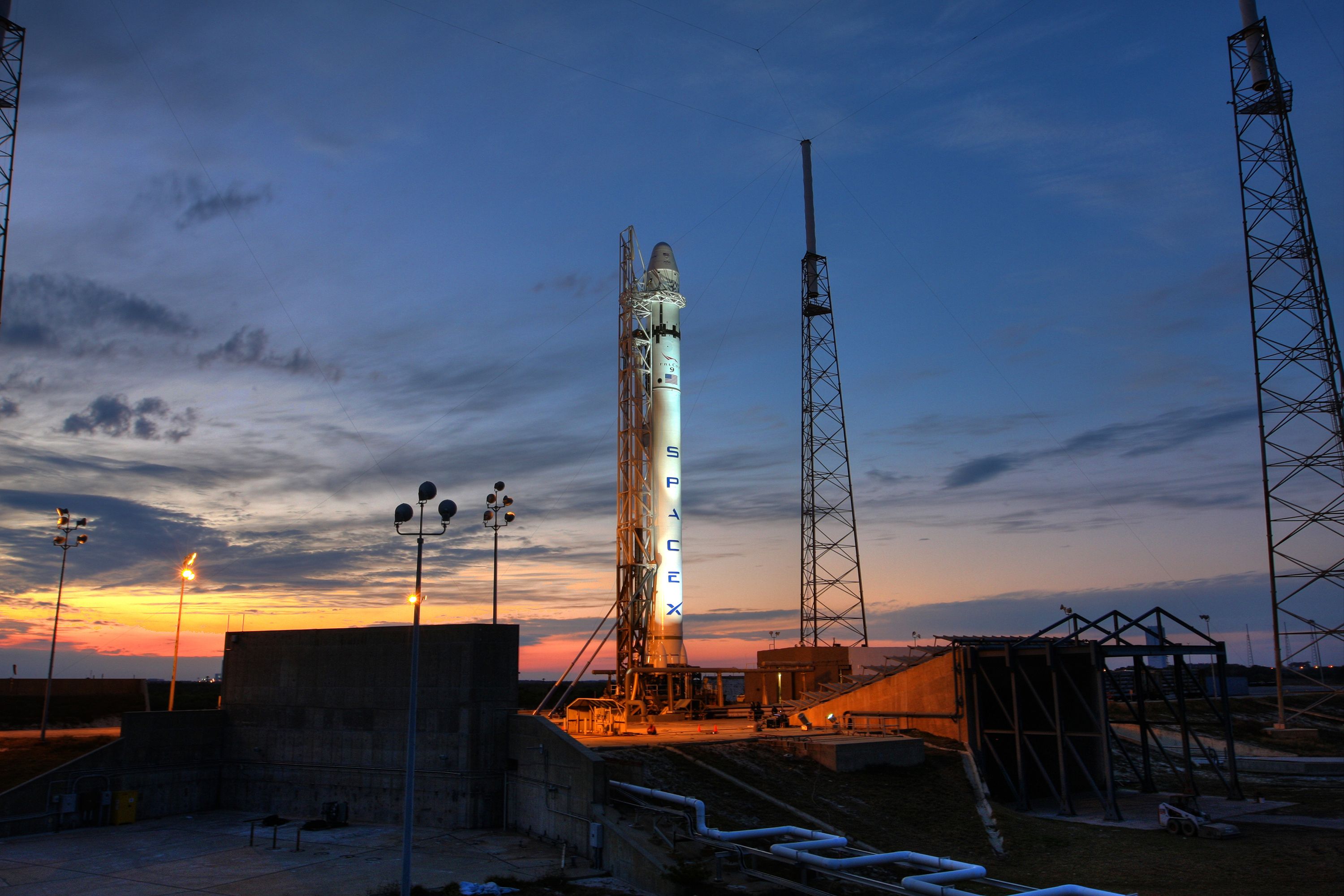 Rocket launching toward orbit at dusk